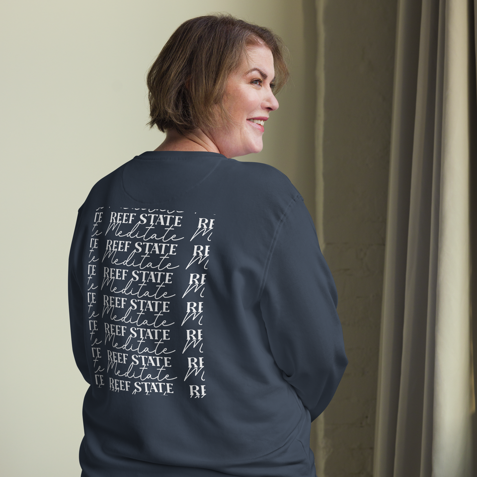 Woman wearing the French Navy Reef State, Meditate sweatshirt, seen from the back