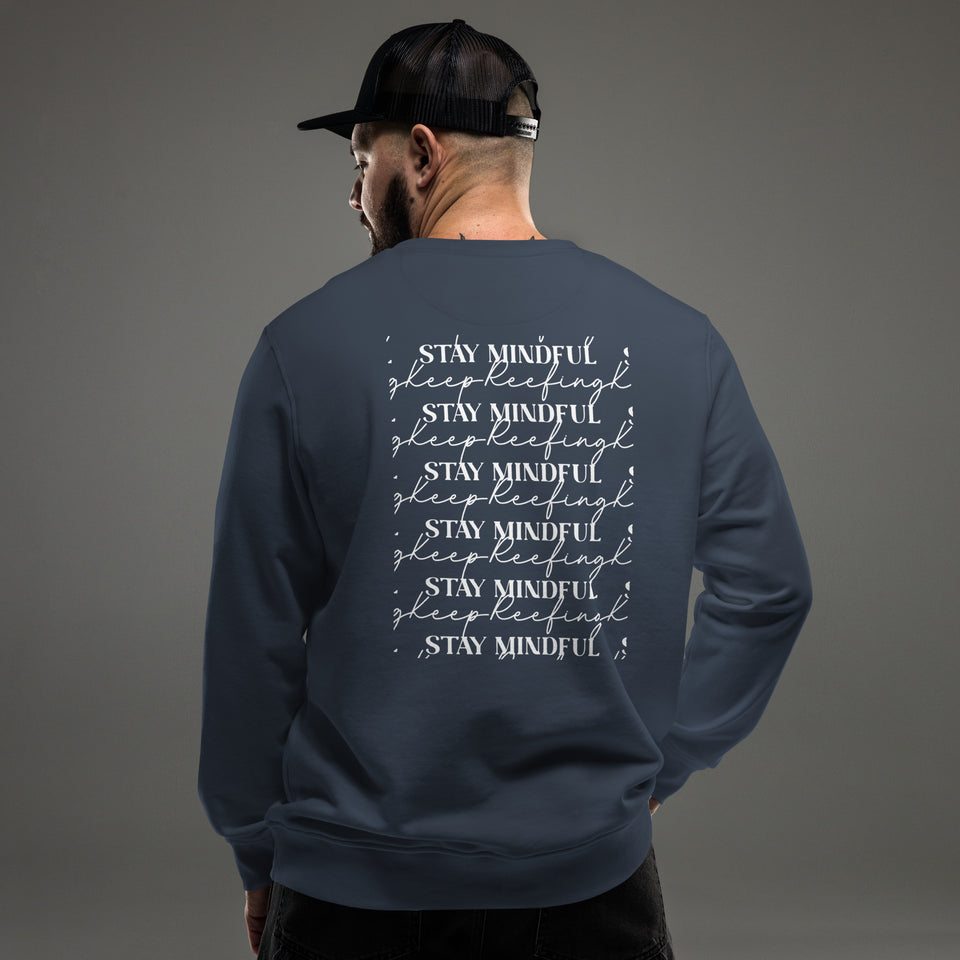 Man wearing the French Navy Stay Mindful, Keep Reefing sweatshirt, seen from the back