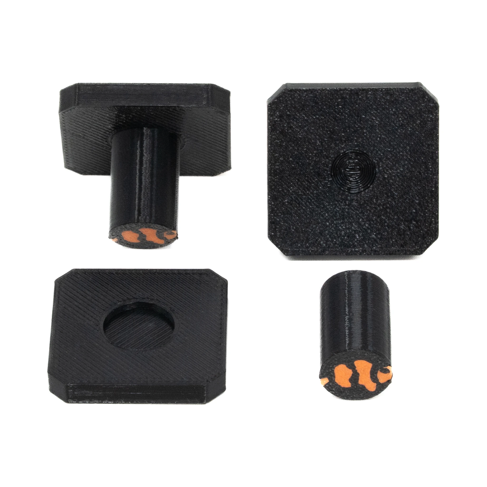 Square black frag plugs shown from above with their detachable stems