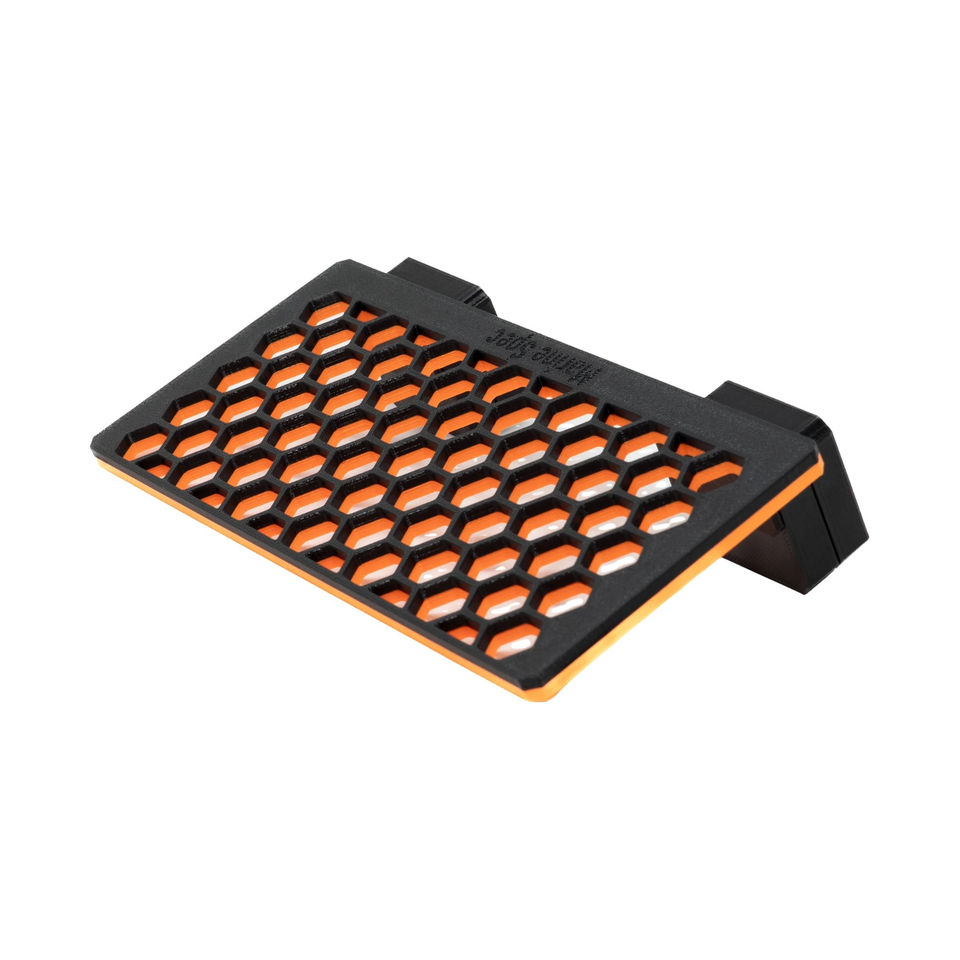 Standard magnetic frag rack in Clown Orange with its magnet block at the side