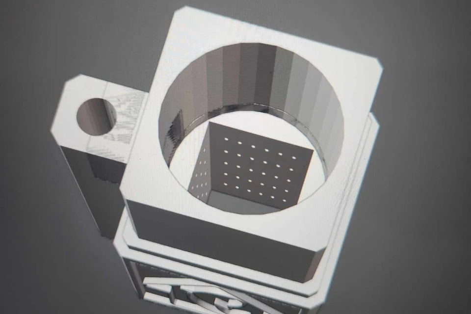 Render of a custom matten filter design with a round opening and a grid of holes