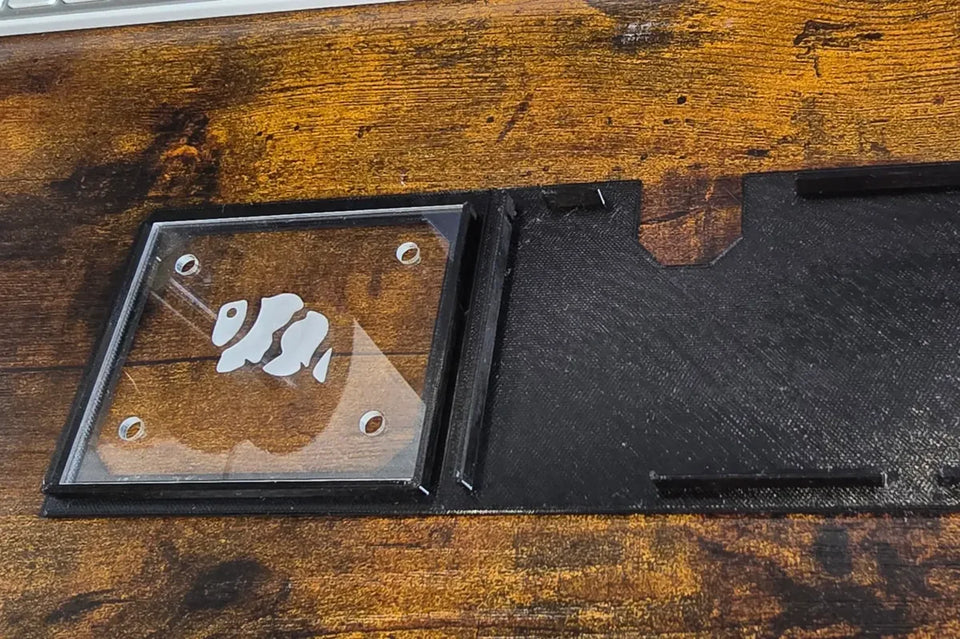 Fluval Evo lid end section with a framed clear acrylic window beside the cutout lid piece