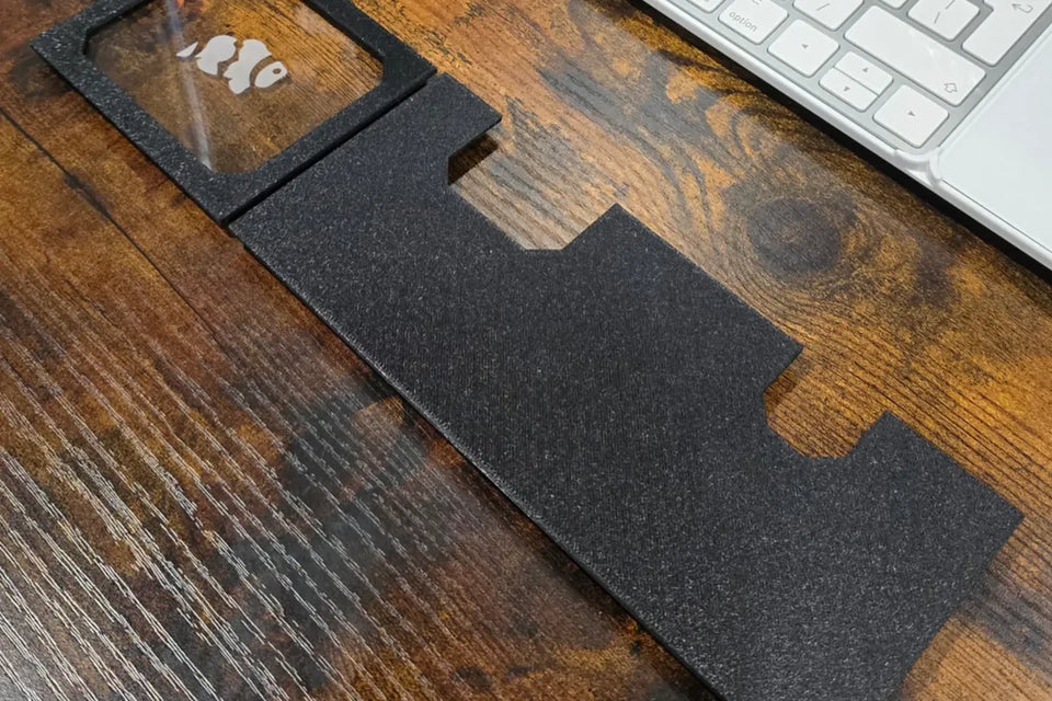 Black 3D printed Fluval Evo rear lid with a clear acrylic window engraved with a fish